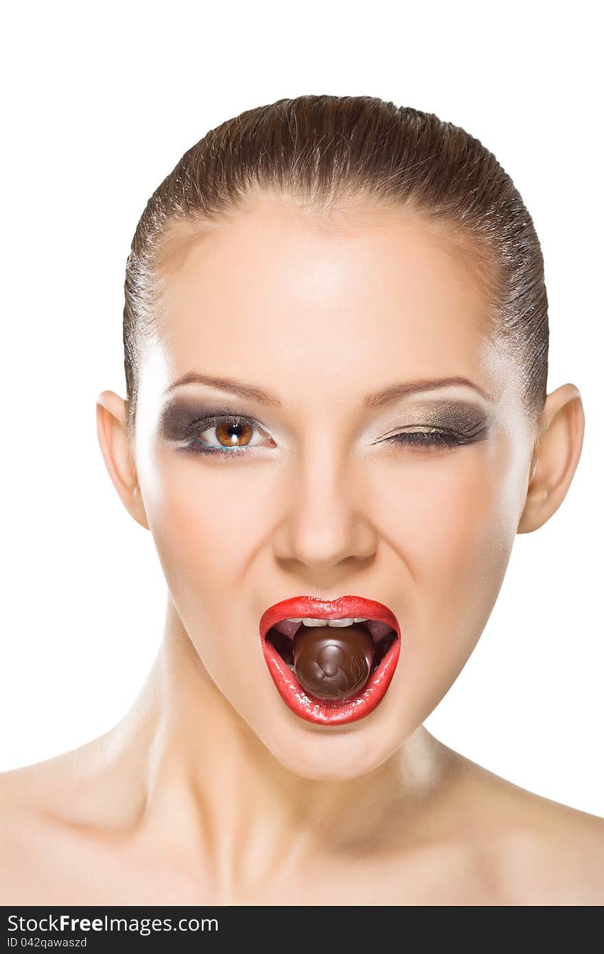 Beautiful Young Woman Eating Chocolates