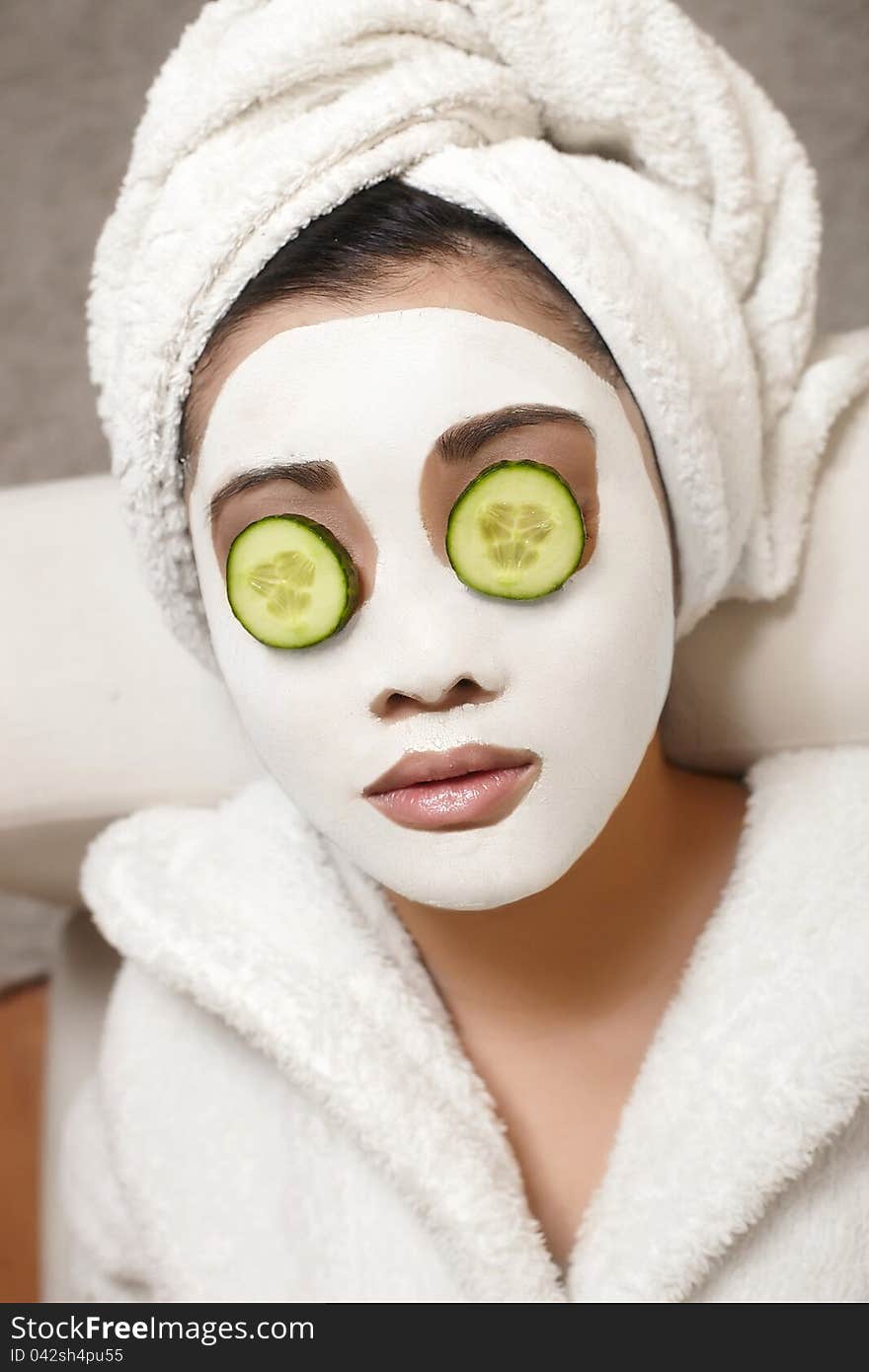 Chinese Woman with cucumbers and mask