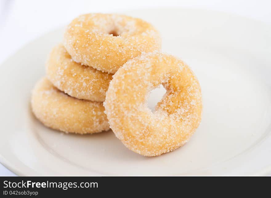 4 donuts on white plate. 4 donuts on white plate