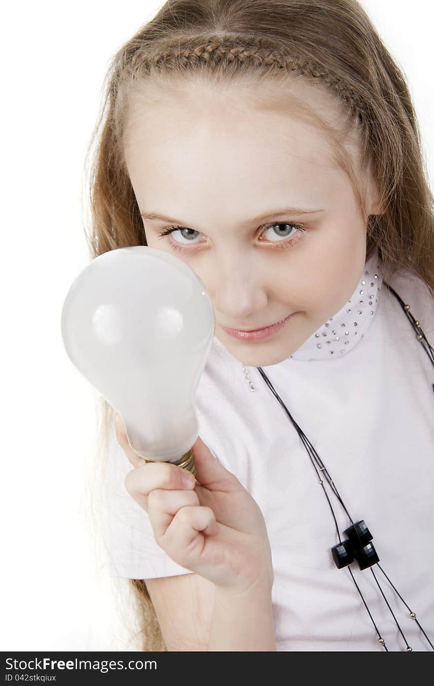 Girl the teenager holds a bulb. Girl the teenager holds a bulb