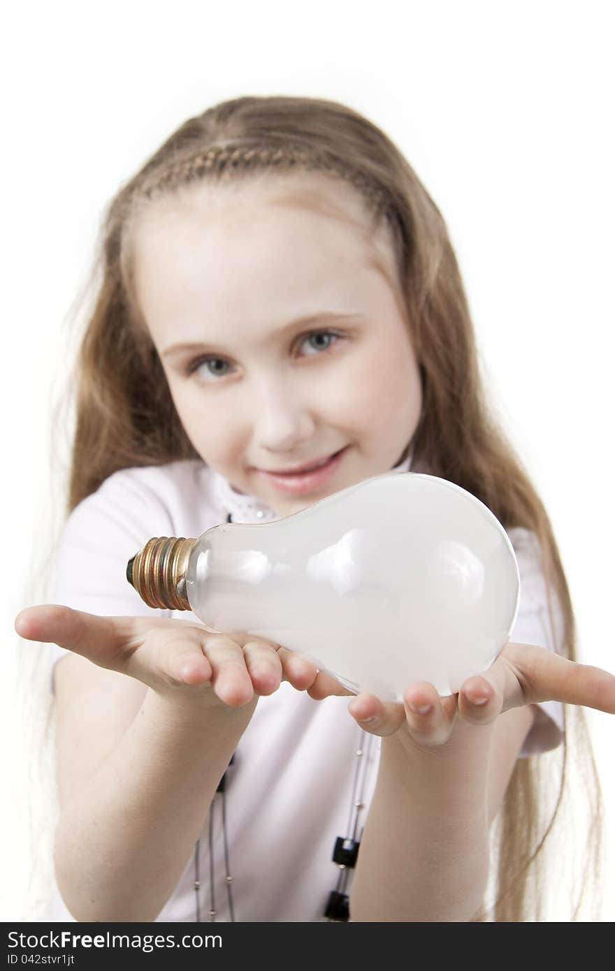 Girl the teenager holds a bulb. Girl the teenager holds a bulb