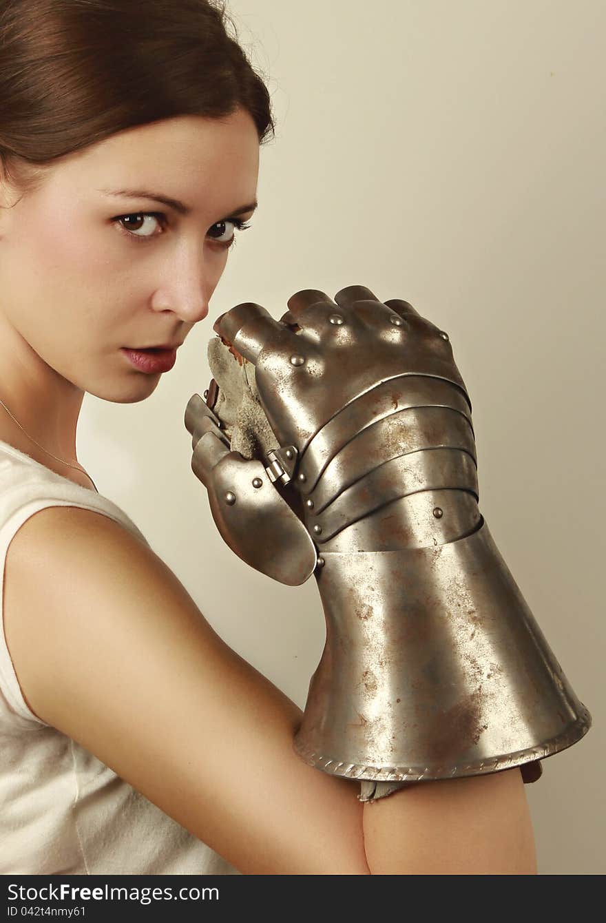 Young woman with steel glove vertical portrait