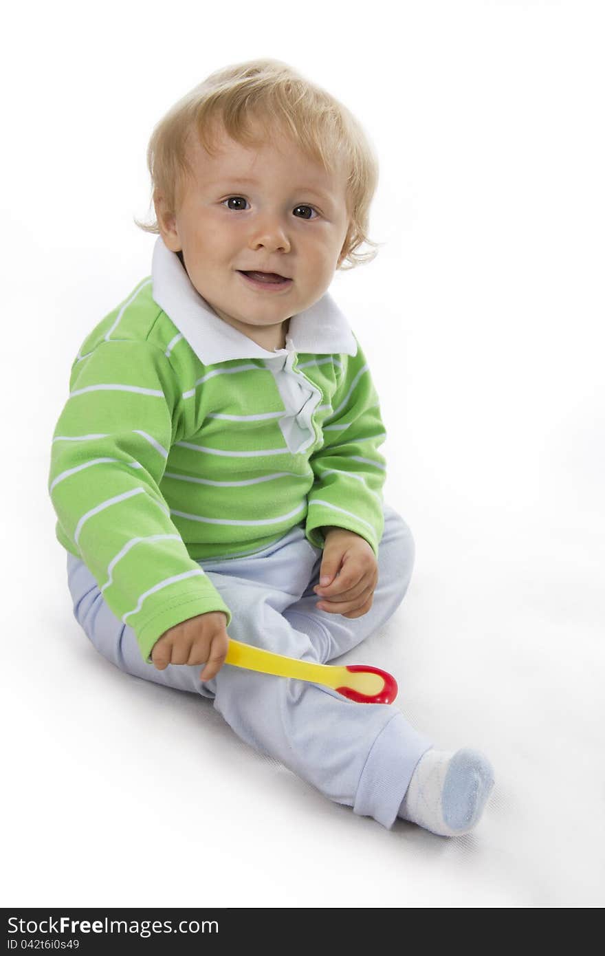 Portrait of sitting down small child on white. Portrait of sitting down small child on white.