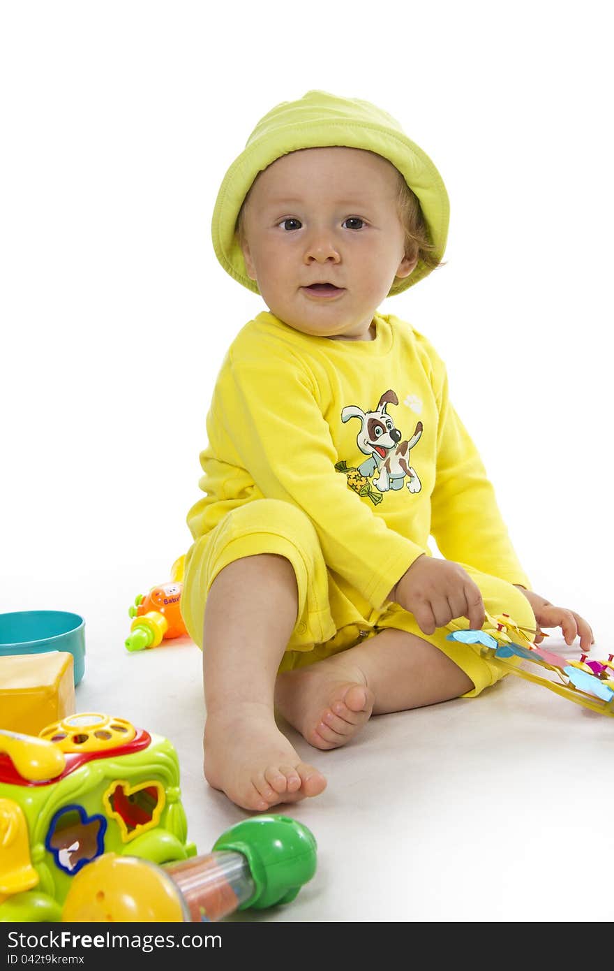 Portrait of sitting down small child on white. Portrait of sitting down small child on white.