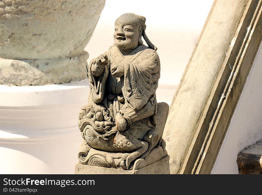 Chinese doll stucco in temple Thailand