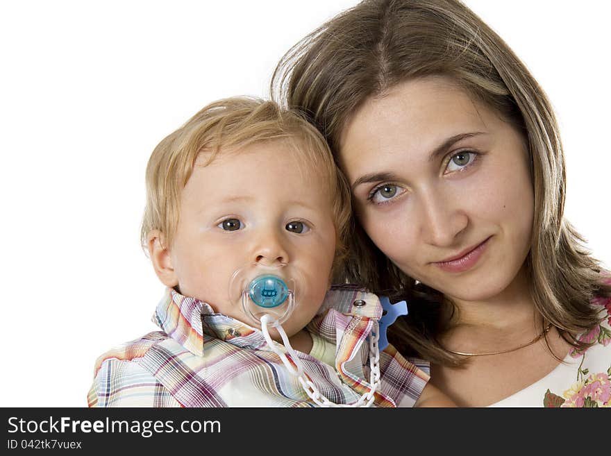 Baby with a dummy in his mouth on hands at mother. Baby with a dummy in his mouth on hands at mother