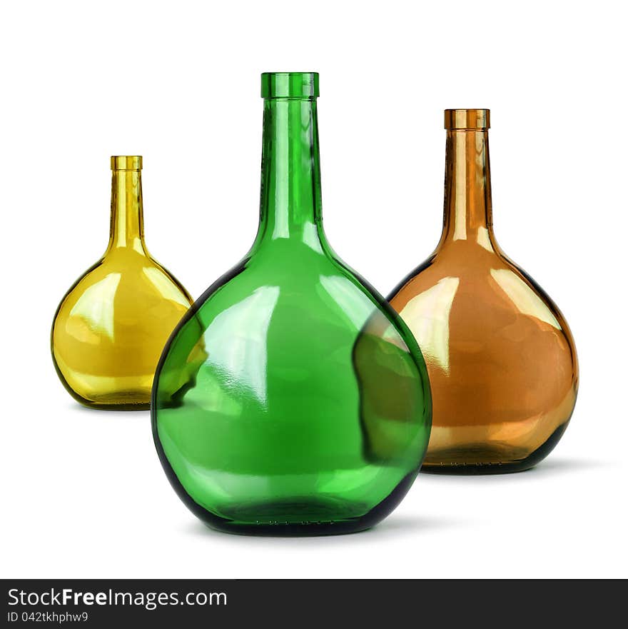 Exotic colorful glass bottles on white background