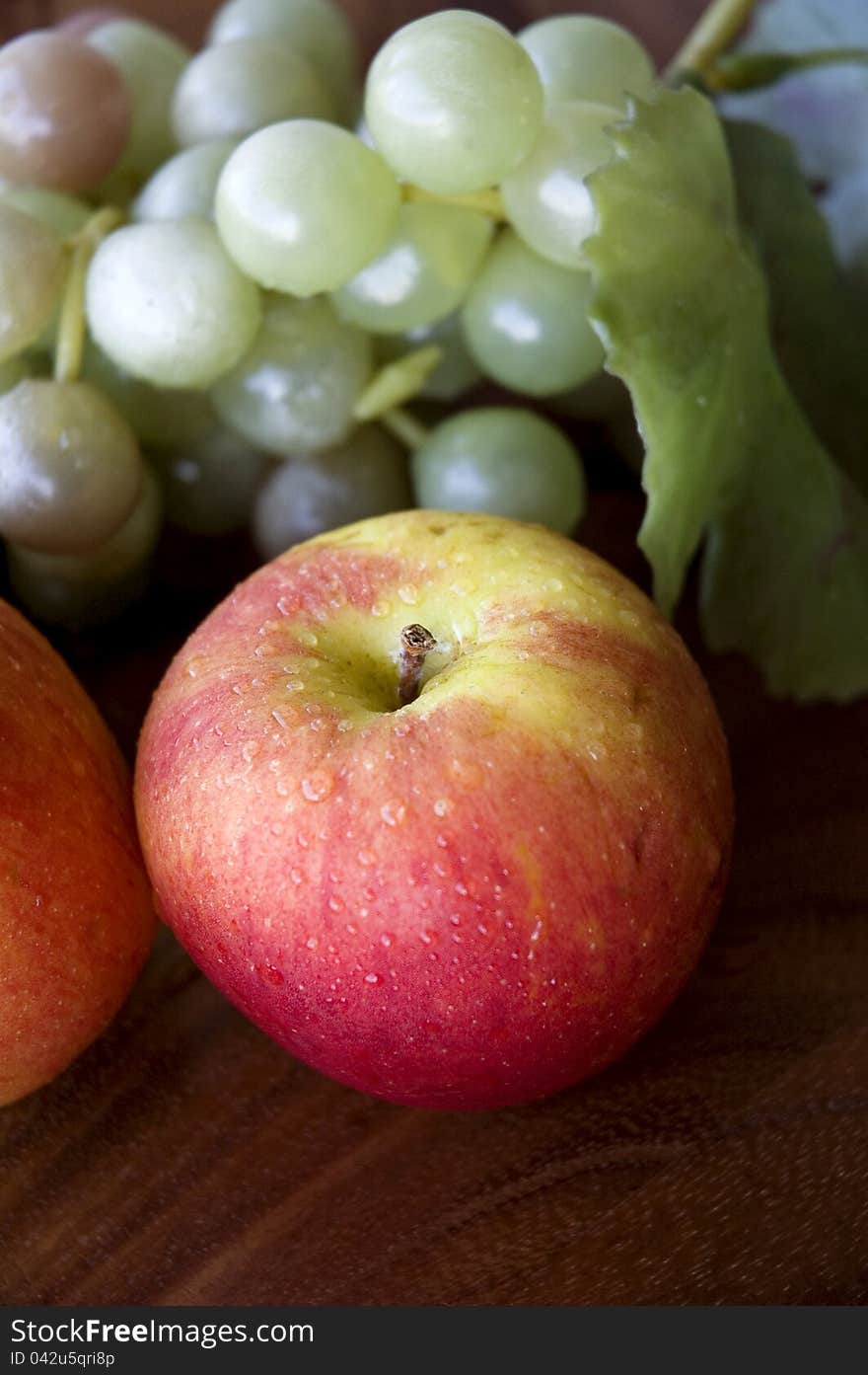 Red apple with grapes