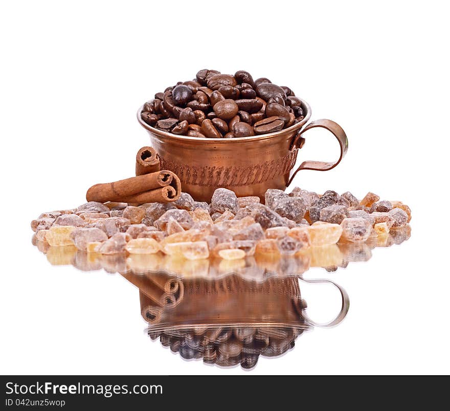 Brown sugar,Coffee beans, coffee cup, cinnamon sticks, white background ,reflection