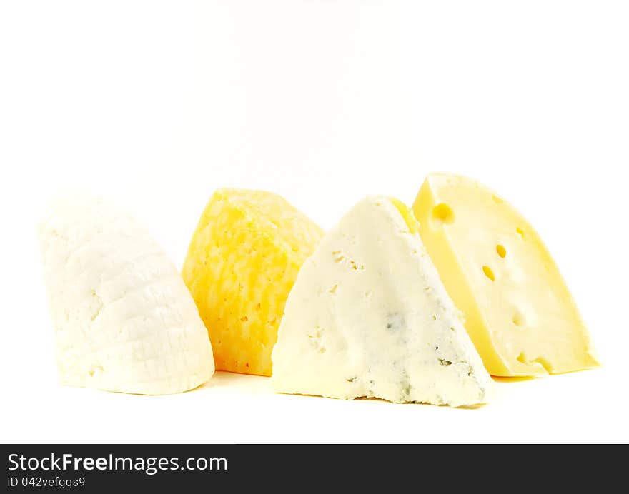 Assortment of various types of cheese  on a white background. Assortment of various types of cheese  on a white background