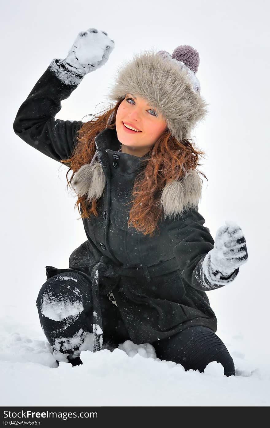 Young Beautiful Woman play with snow