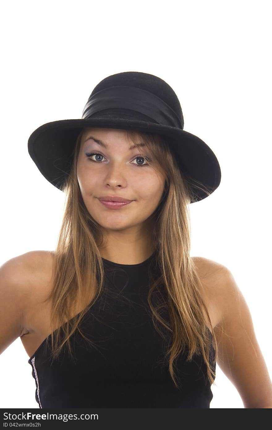 Young woman in a black hat on a white background