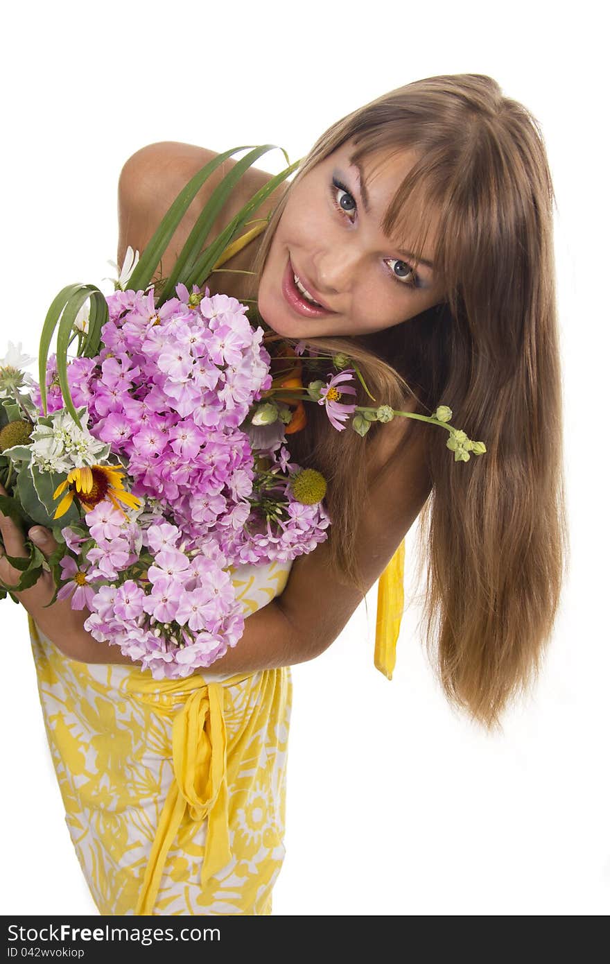 Beautiful girl holds a bunch of flowers, isolated. Beautiful girl holds a bunch of flowers, isolated