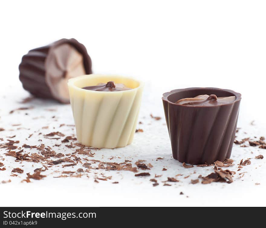 Chocolate baskets and chips on a white background.