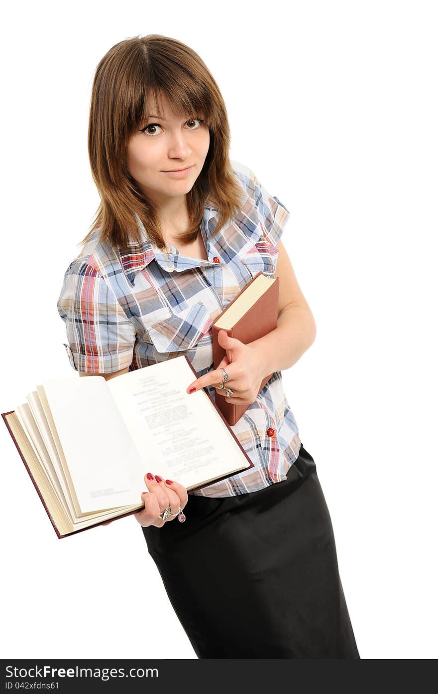 Girl shows in the book on a white background. Girl shows in the book on a white background