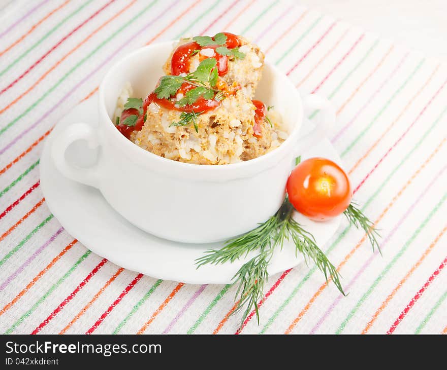 Bowl of meatballs with vegetables , called hedgehogs. Bowl of meatballs with vegetables , called hedgehogs