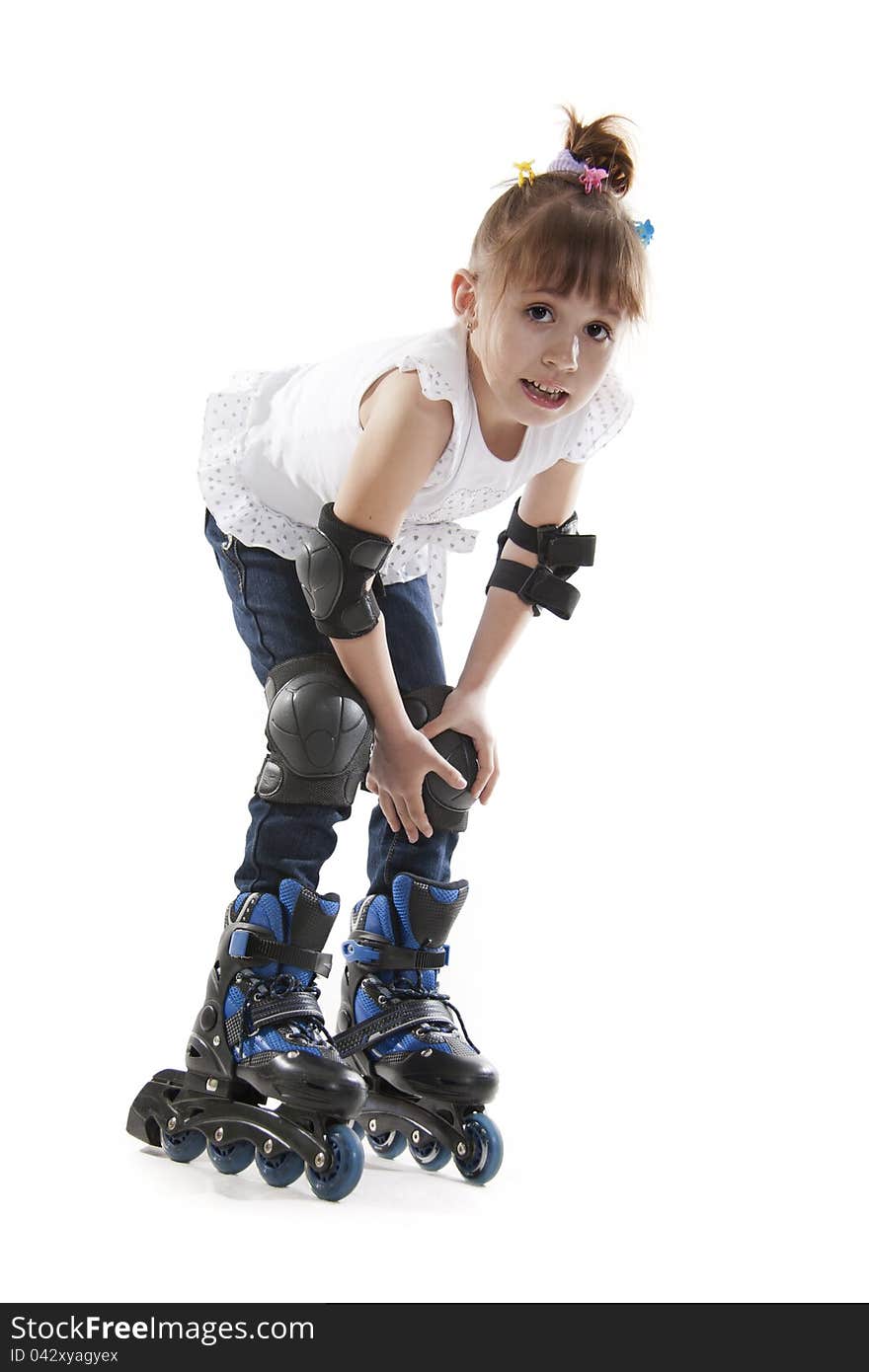 The little girl on roller skates. white