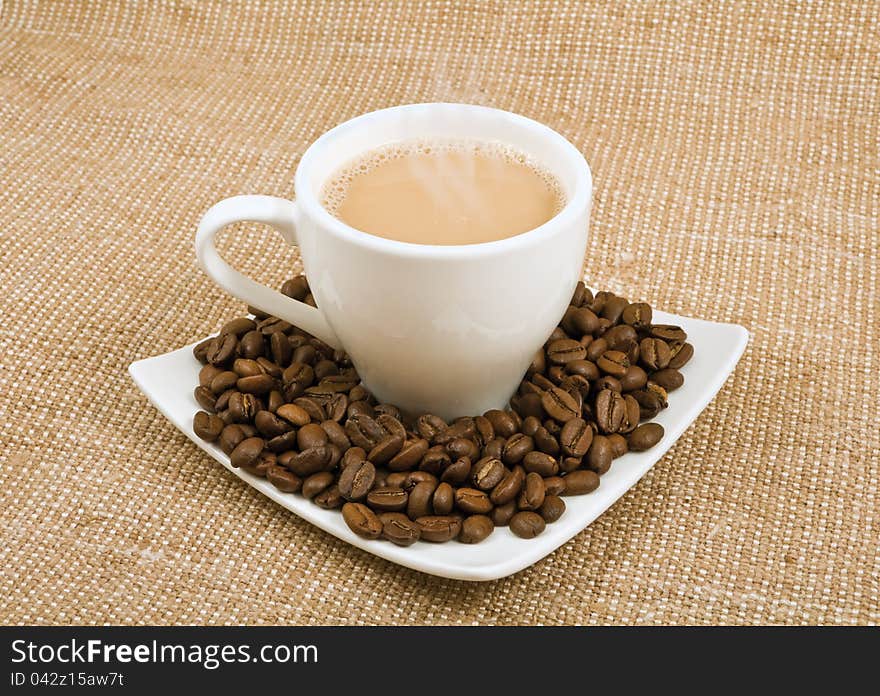 Coffee And Milk And Saucer With Grains