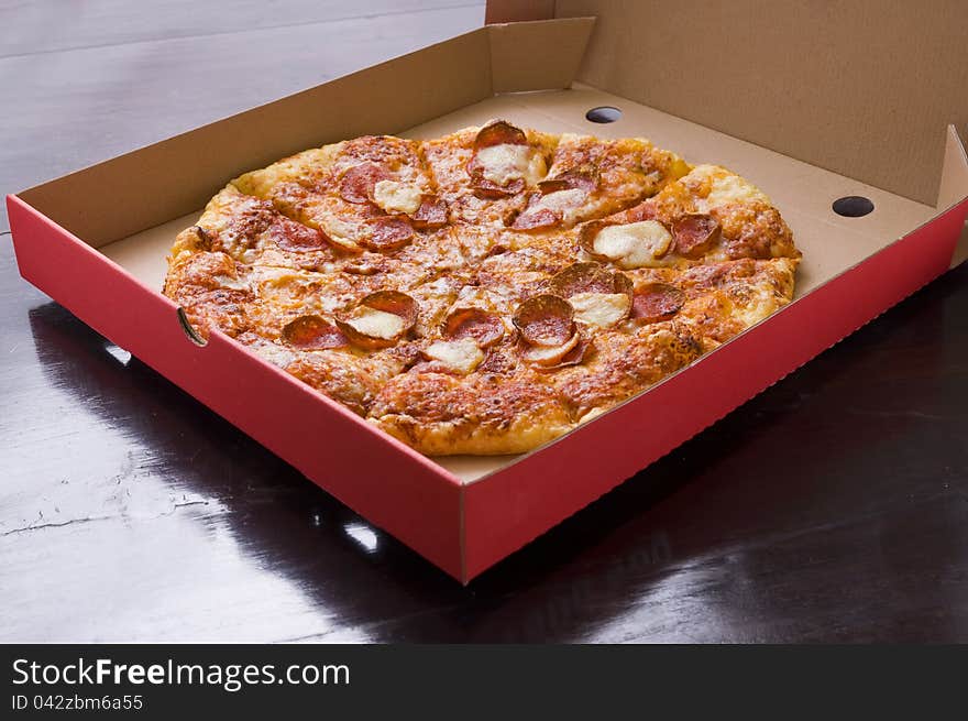 Pepperoni Pizza shot in the pizza box, you can put your writing on the box