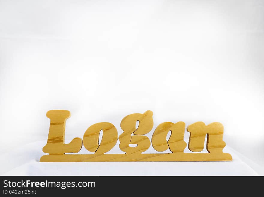 Wooden name plate with the name Logan on it. Wooden name plate with the name Logan on it