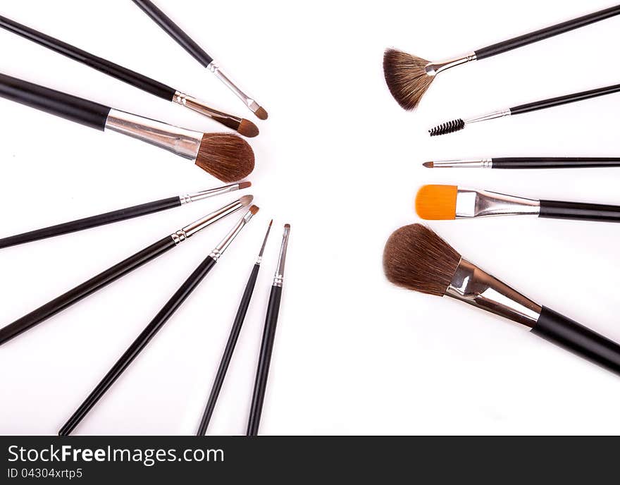 Professional make up and powder brushes on white