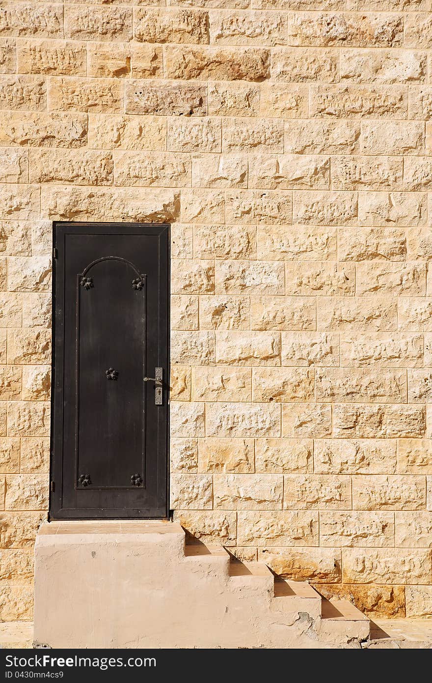 Old door entrance with stairs in Jordan