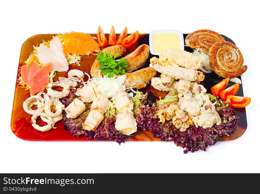 Meat a grill and seafood on a tray on white background