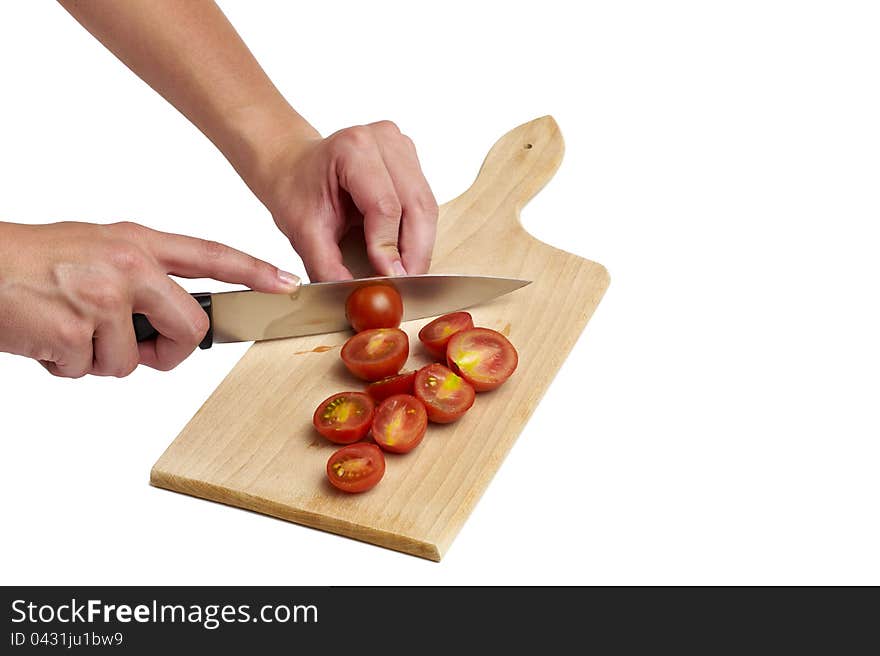 Cutting tomato on white background