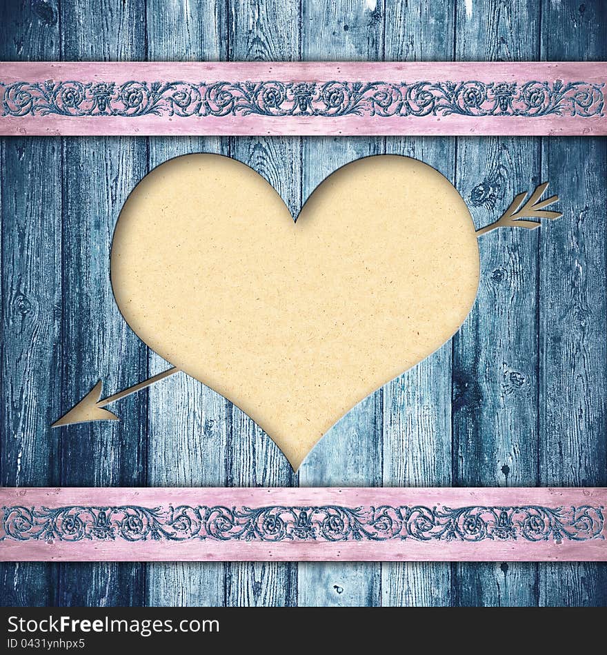 Wooden boards with a hole in the form of heart and a paper for your text behind. A background in style retro. Wooden boards with a hole in the form of heart and a paper for your text behind. A background in style retro.