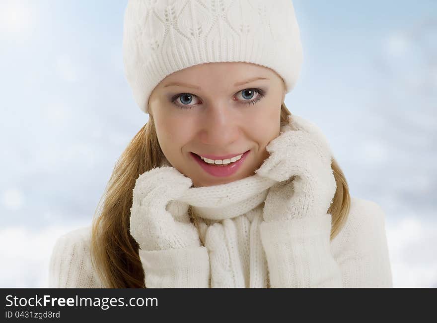 Winter portrait of a beautiful happy girl outdoors