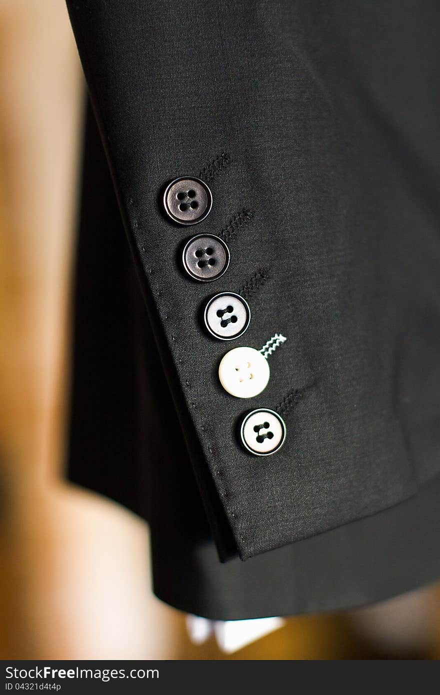 Buttons on a sleeve of a man's suit. Buttons on a sleeve of a man's suit