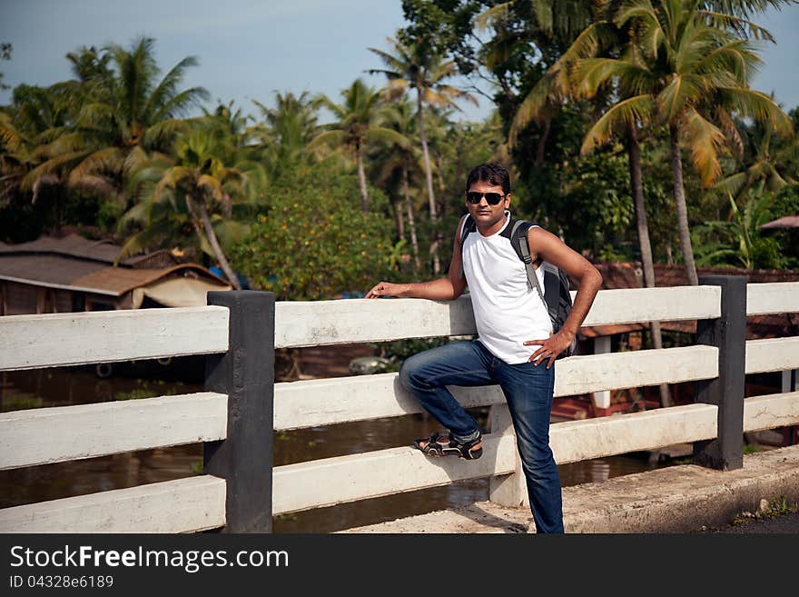 Indian Happy young man with sunglasses, standing. Indian Happy young man with sunglasses, standing