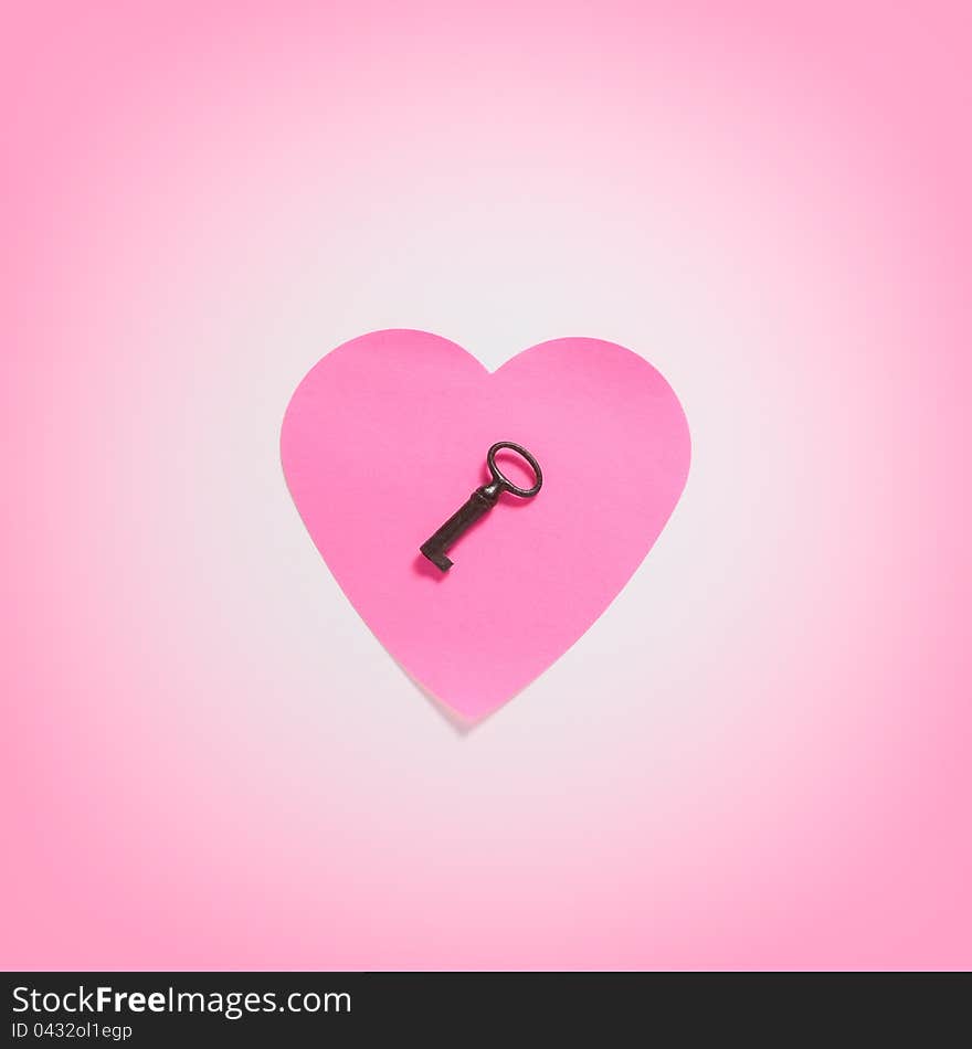 Paper heart with key in pink fog. Paper heart with key in pink fog