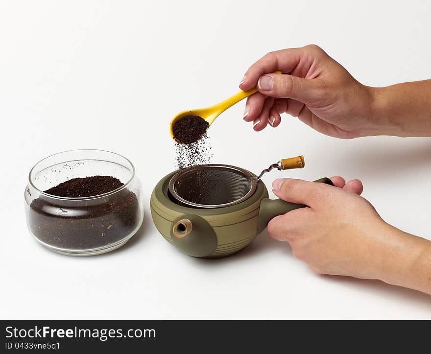 Person s hand preparing tea