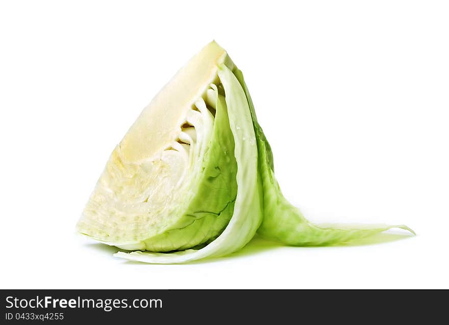 Cut cabbage on white surface. Cut cabbage on white surface.