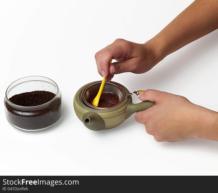 Person s hand preparing tea