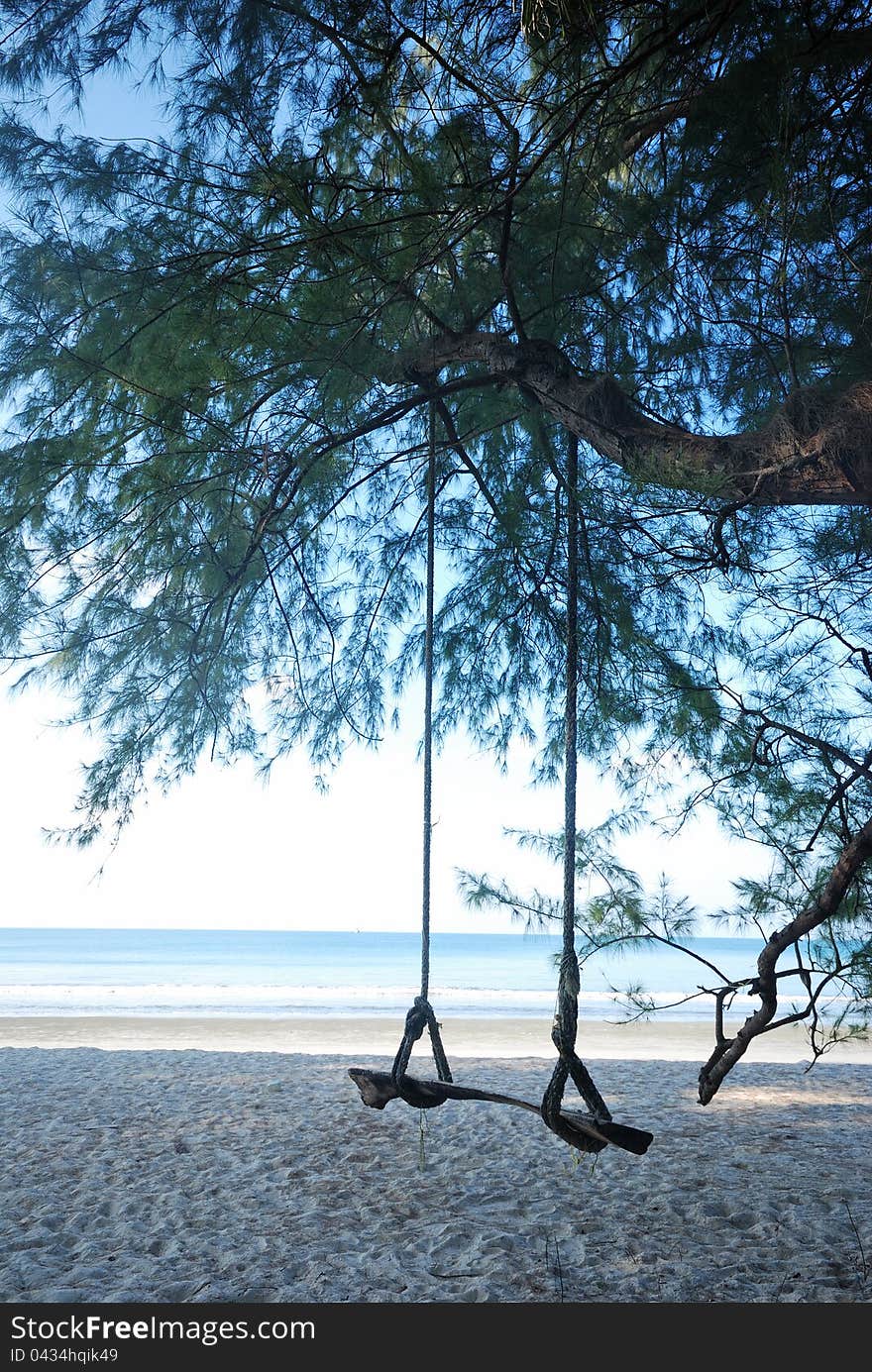 Swing the picture on the beach during the day for relaxation. Swing the picture on the beach during the day for relaxation