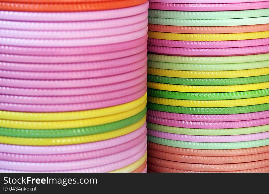 Plates of various colors piled on one above the other. Plates of various colors piled on one above the other