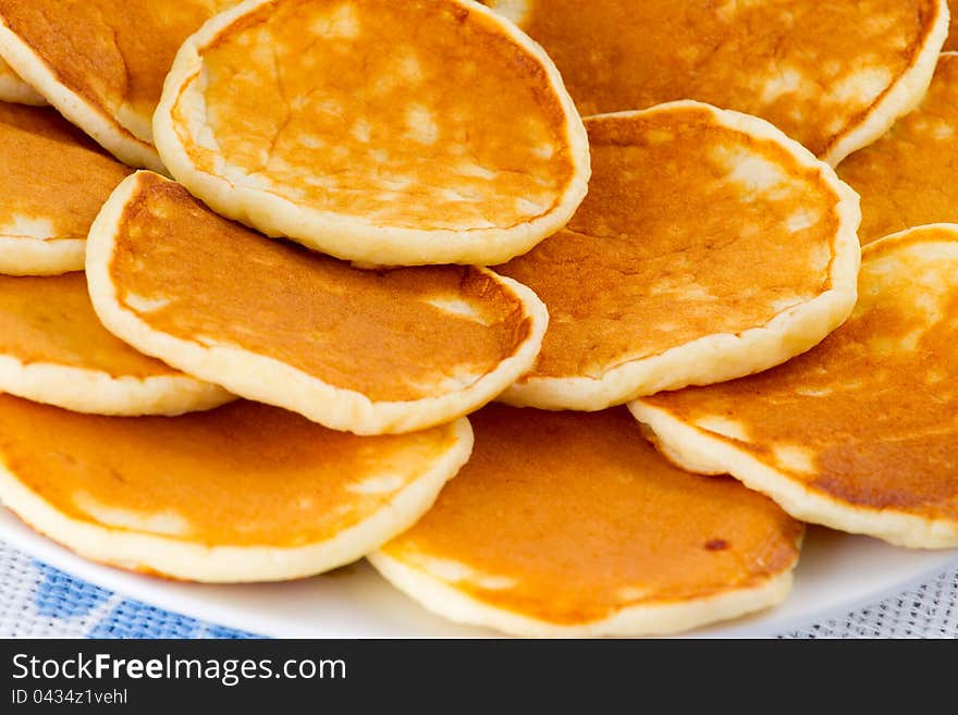 Pancakes on a plate closeup. Pancakes on a plate closeup