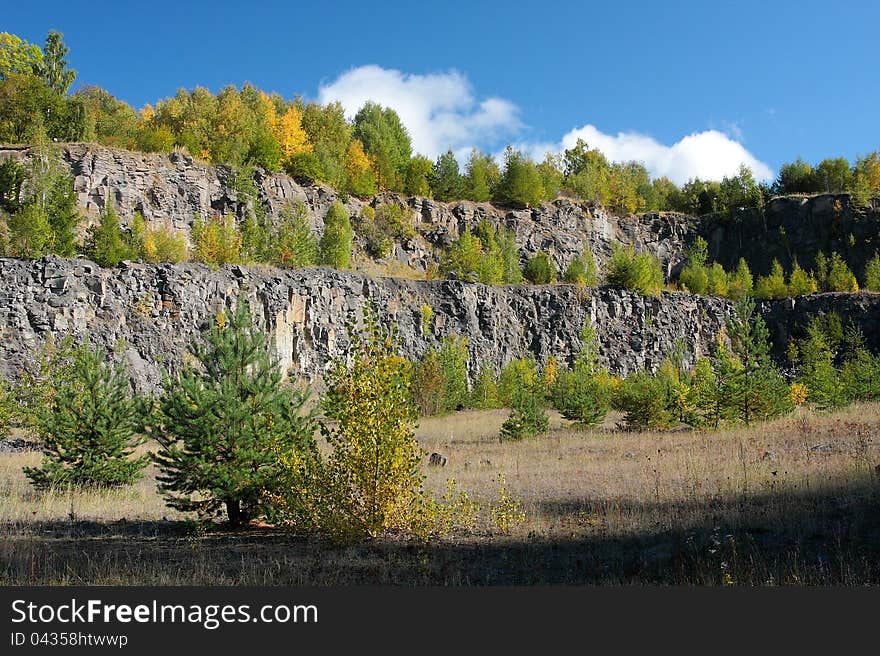 Old basalt quarry with trees. Old basalt quarry with trees