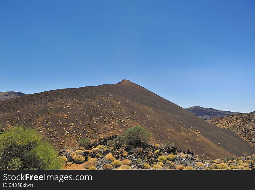 Volcanic ash hill, National Park of Las Canadas of Teide, island Tenerife. Volcanic ash hill, National Park of Las Canadas of Teide, island Tenerife.