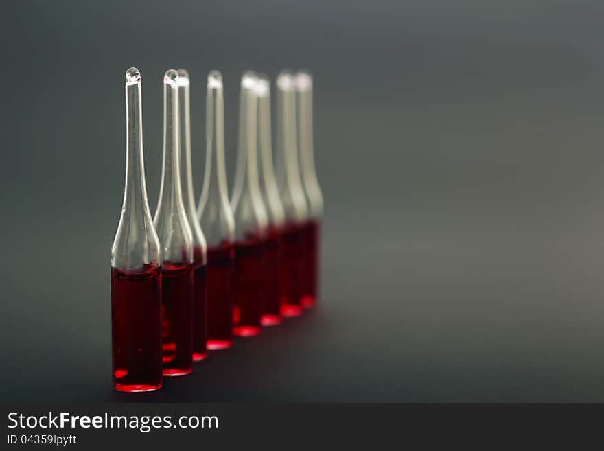 Medical ampoules on a black background close up