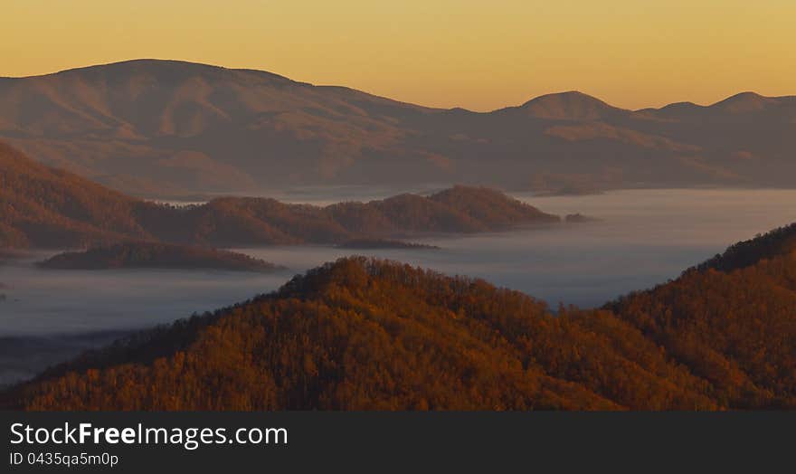 Mist covered Appalachian mountains, in North Carolina in autumn, at sunrise. Mist covered Appalachian mountains, in North Carolina in autumn, at sunrise