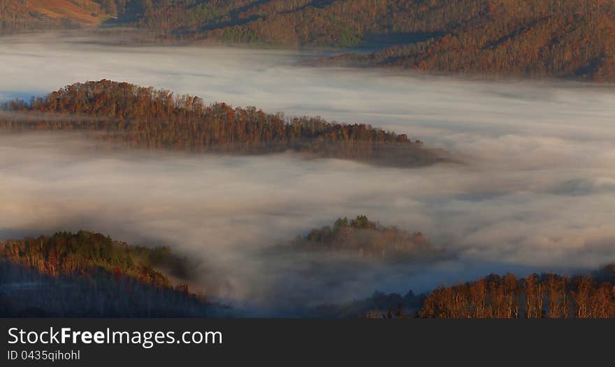 Mist covered Appalachian mountains, in North Carolina in autumn, at sunrise. Mist covered Appalachian mountains, in North Carolina in autumn, at sunrise