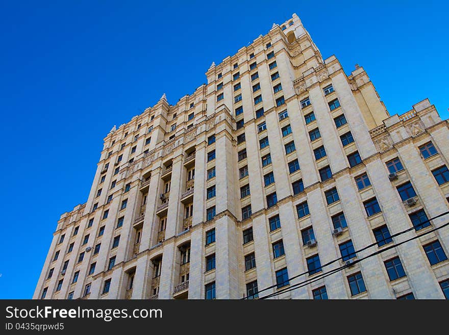 Modern building on blue sky background. Modern building on blue sky background