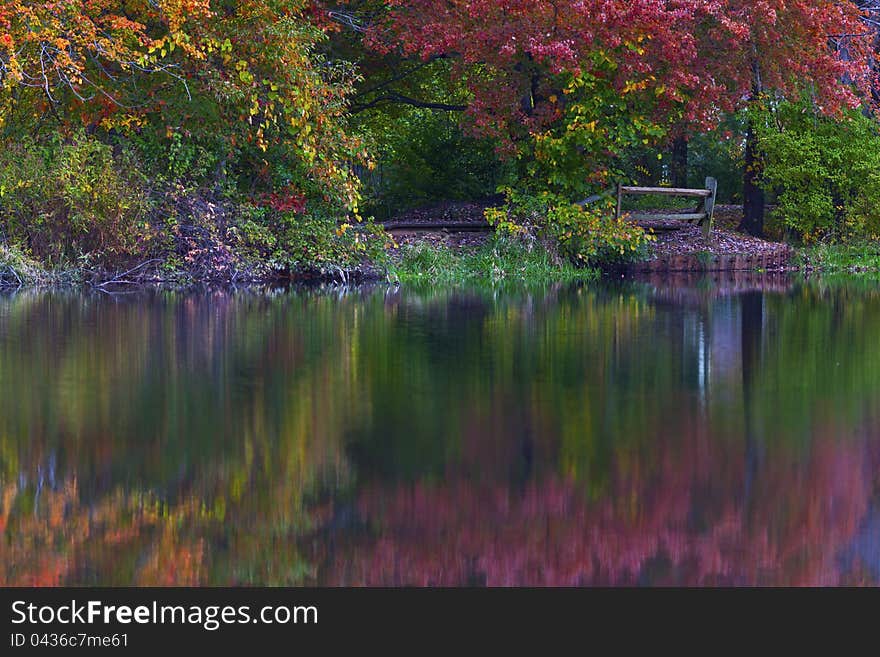 Autumn foliage reflection in lake