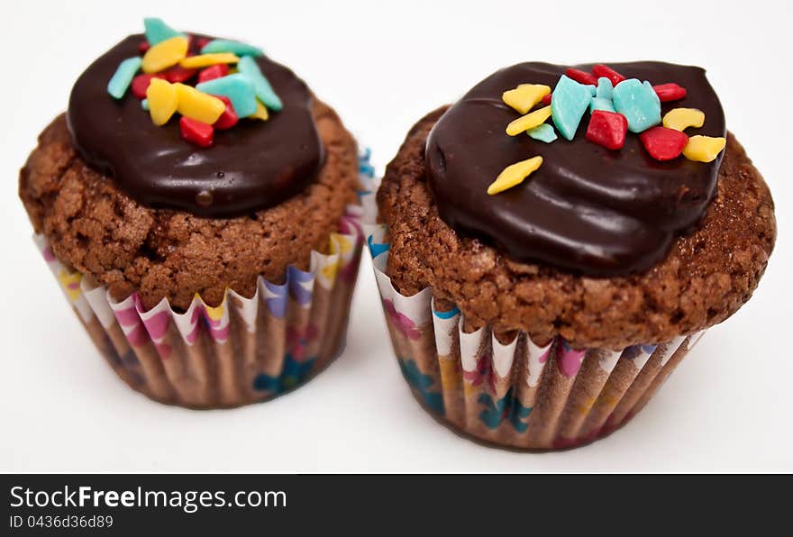 Two delicious muffins  on white background. Two delicious muffins  on white background