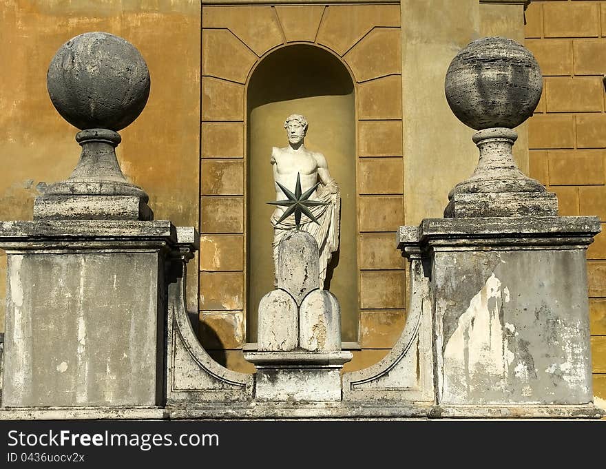 Stone balls and antique sculpture in the courtyard in the Vatican Museum