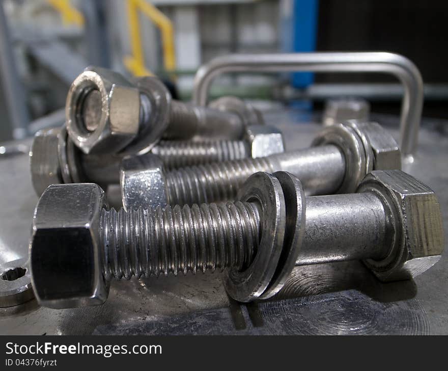 Nuts, bolts, and washers, ready for use in an industrial application. Nuts, bolts, and washers, ready for use in an industrial application.