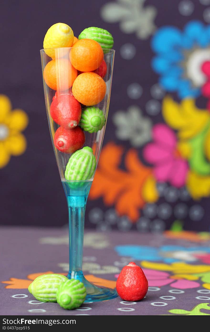 Colorful chewing gums in a champagne glass. Colorful chewing gums in a champagne glass